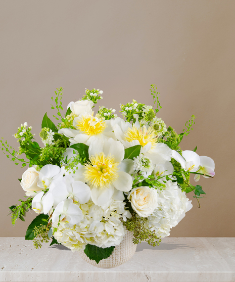 Estella Flower Arrangement: A stunning floral masterpiece featuring a variety of blooms in an elegant vase