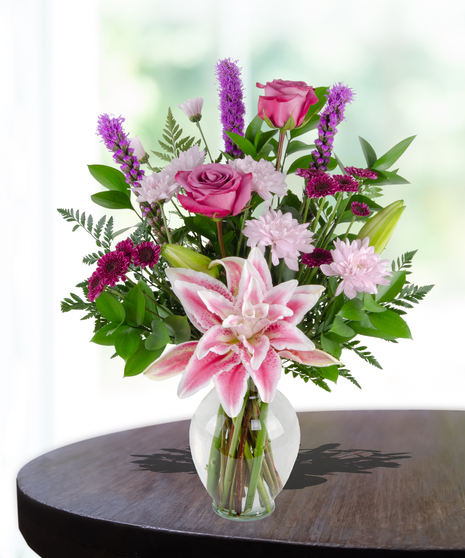 Lovely Lavenders Flower Arrangement for Mother's Day: A stunning display of lavender-hued blooms in a chic vase