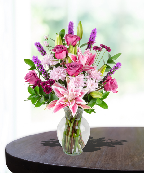 Lovely Lavenders Flower Arrangement for Mother's Day: A stunning display of lavender-hued blooms in a chic vase