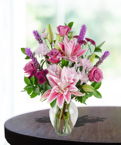 Lovely Lavenders Flower Arrangement for Mother's Day: A stunning display of lavender-hued blooms in a chic vase