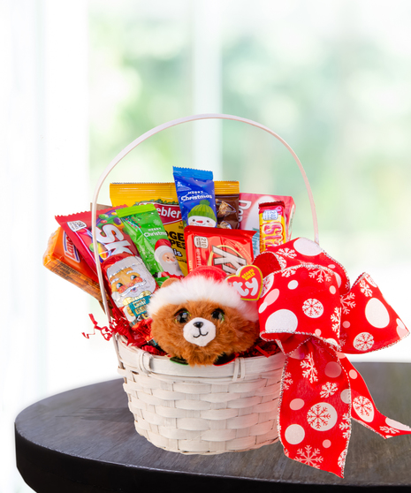 Polar Express Christmas Candy Basket filled with holiday treats, chocolates, peppermint candies, and festive decorations from Billy Heroman's Florist in Baton Rouge, LA.