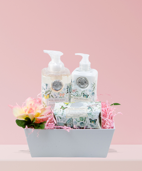 Spa Time, My Valentine Bath & Body Gift Set featuring Michel Design Works Butterfly Fields fragrance products in a woven basket, accented with a pink rose.