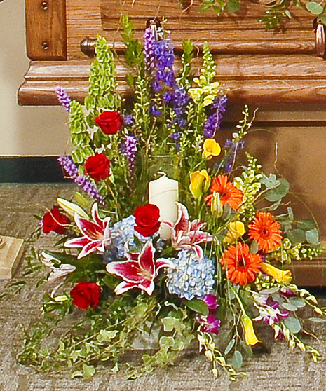 Vivid beauty memorial candle arrangement delivered in Baton Rouge, LA. 